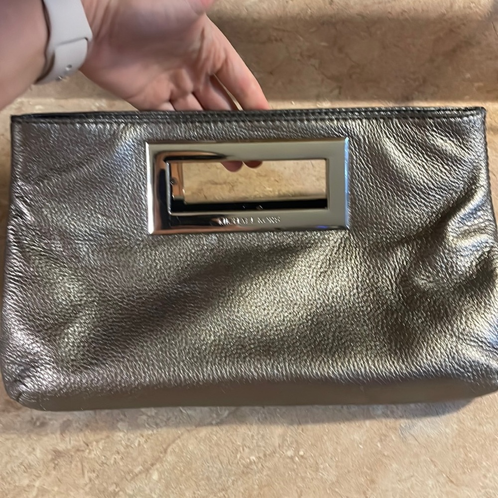 Michael Kors used clutch minor wear. Check photos